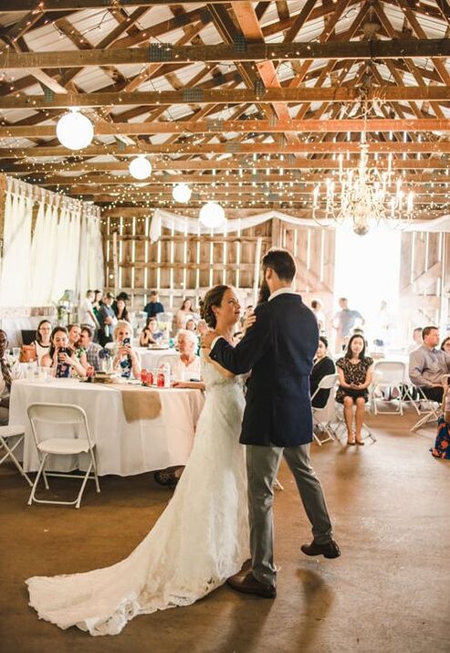 A newly married couple has their first dance inside this rustic wedding venue in Vermont.